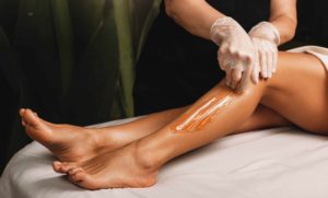 Woman Getting Leg Waxing Treatment | Sutera Spa in Flower Mound, TX