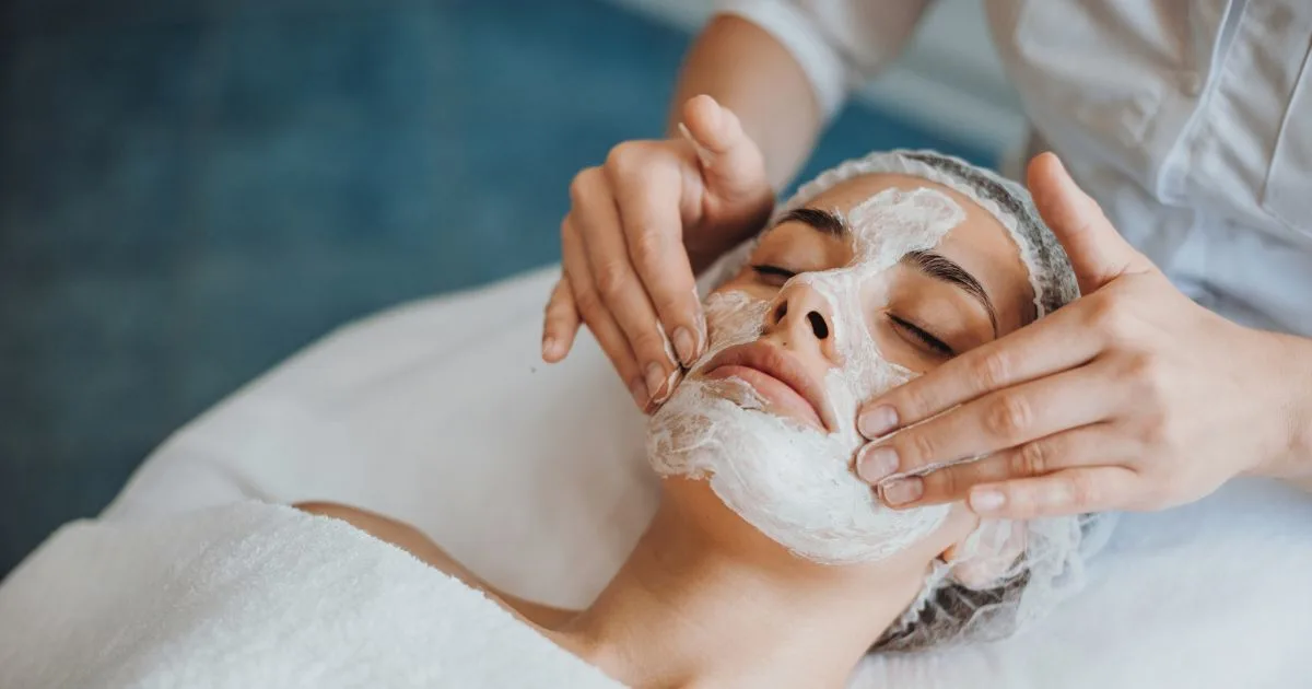 Esthetician applying a masque during a Signature Facial to prepare skin for a special event in Flower Mound, TX.